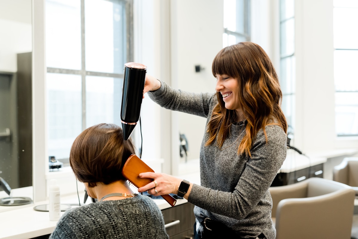 Minimal salon interior with styling stations and mirrors