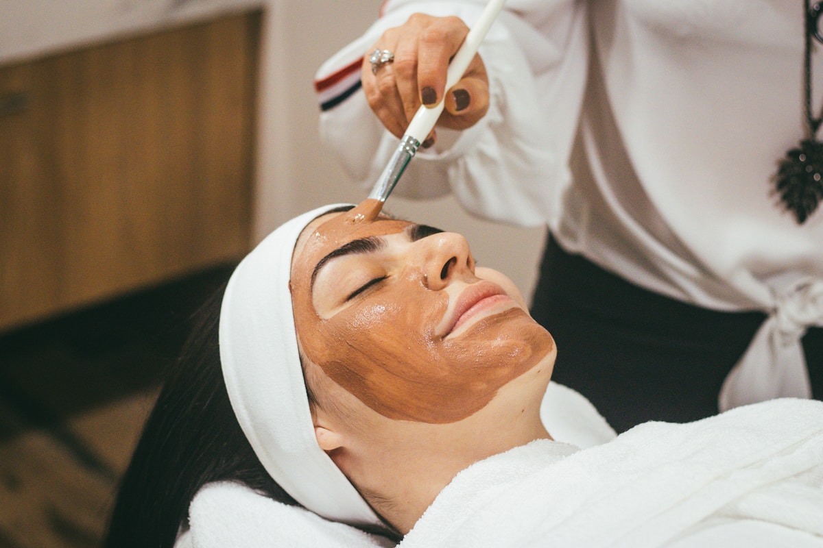 Facial treatment with soft lighting and clean skin focus